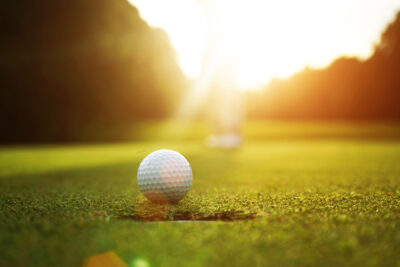 Golfers are putting golf in the evening golf course golf backglound in Thailand